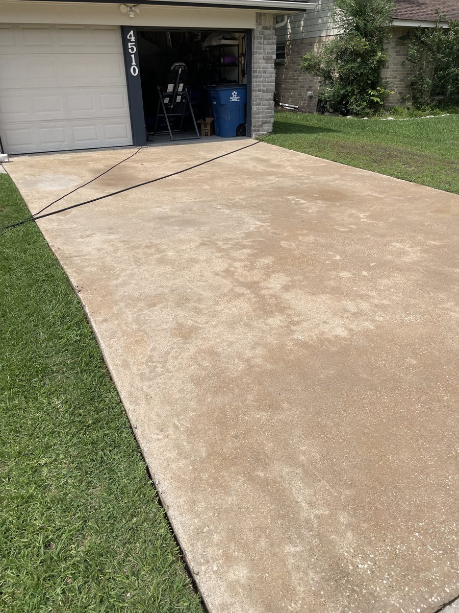 Driveway after power washing — clean concrete